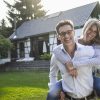 couple standing in front of her house, home, real estate, insurance, future, couple, in balance, family, love, stability, garden, sun, summer, Cologne, NRW, Germany